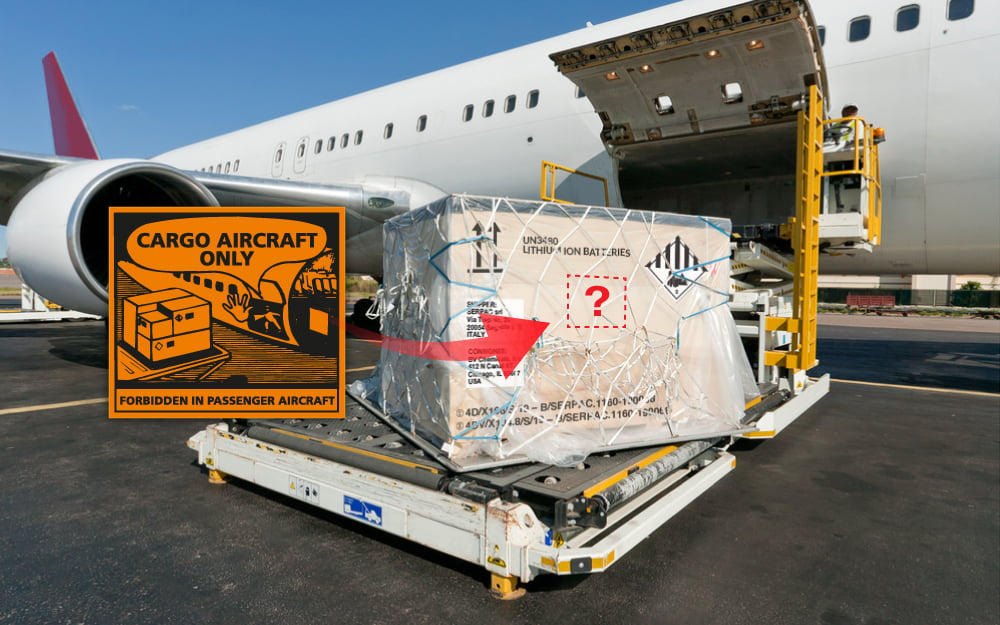 Palletised cargo with CAO marking next to a freighter